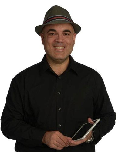 Photo shows a headshot of Dr. Perez holding an iPad.