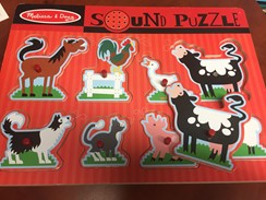 Photo shows a puzzle with various cut-out animal shapes